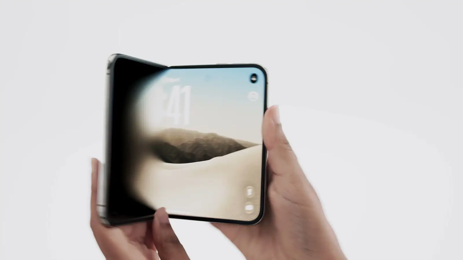 The foldable iPhone closed, its outer display showing a photo and the number 41