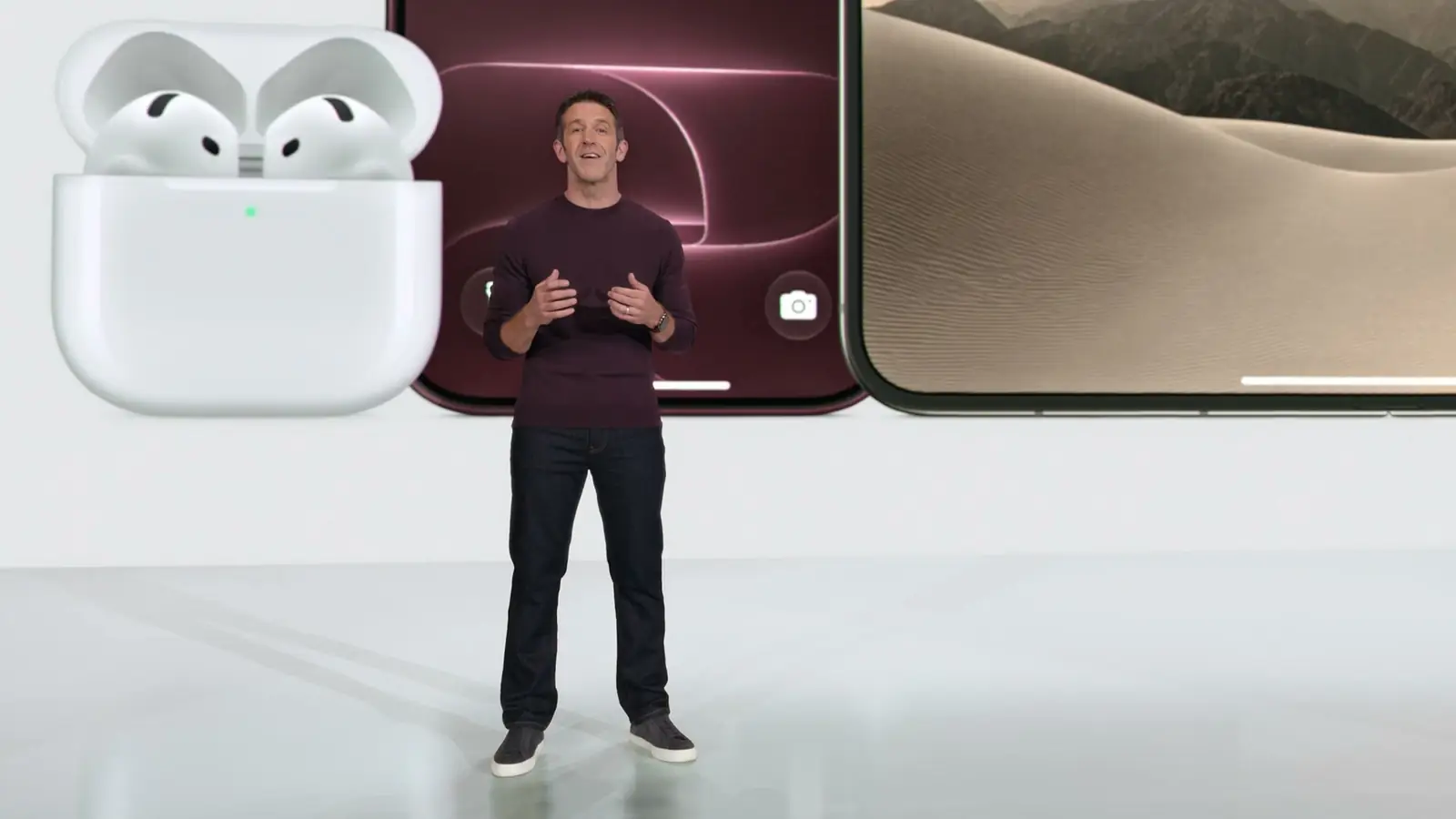 Closing shot of the keynote: the presenter in front of AirPods 5, iPhone 18 Pro, and iPhone Duo