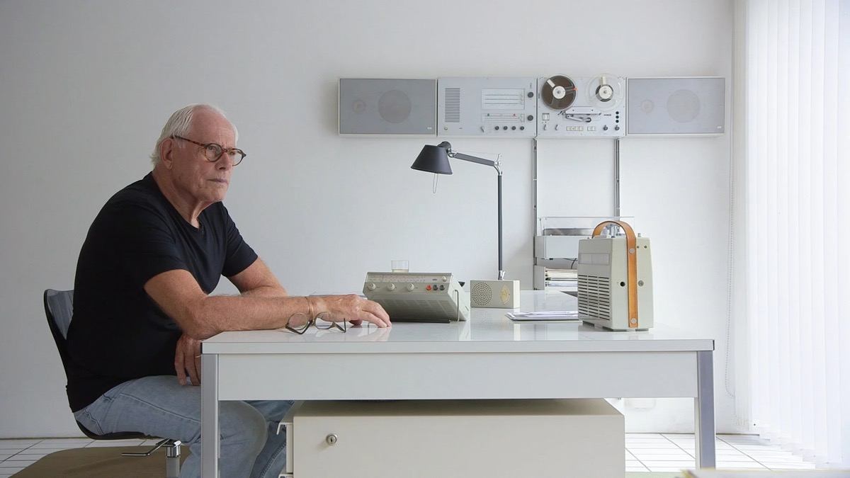 Rams at his desk surrounded by Braun products, from *Rams* by Gary Hustwit