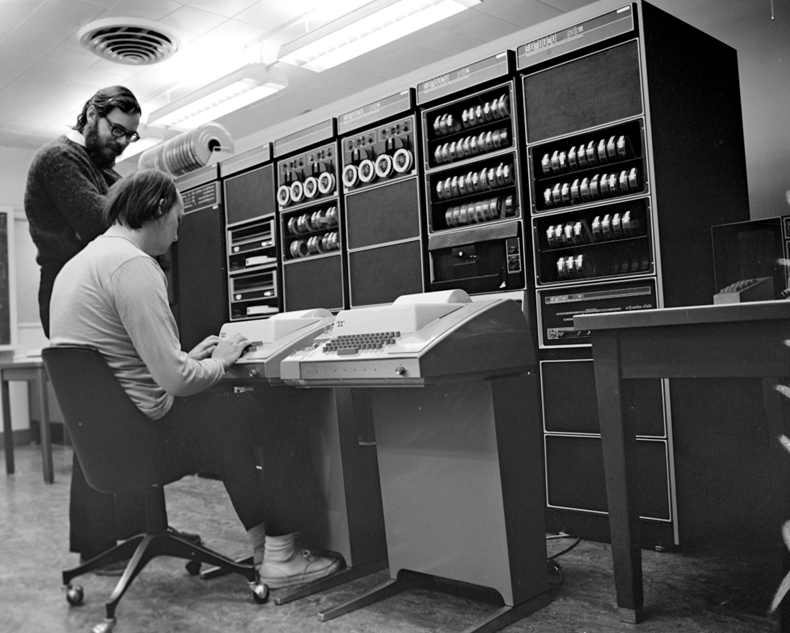 Ken Thompson (seated) and Dennis Ritchie at a PDP-11 at Bell Labs